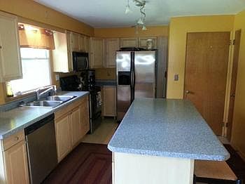 Matching stainless steel appliances with an oversized island