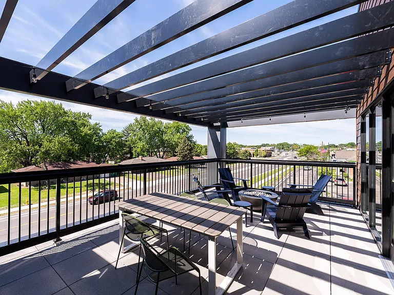 A shaded patio designed for relaxed outdoor gatherings.