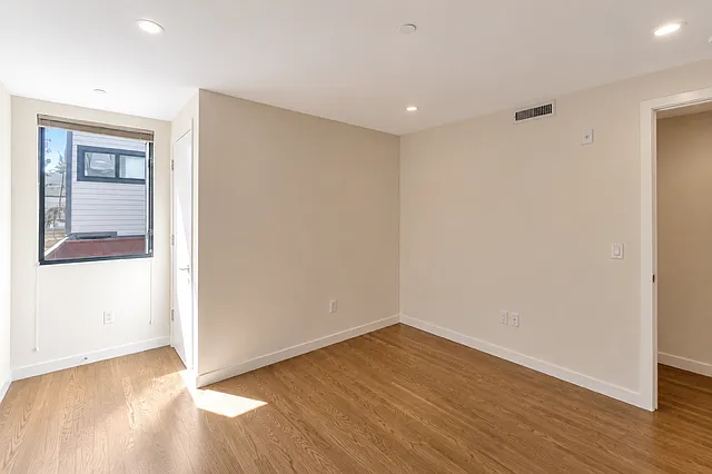 second bedroom, closet on left next to window