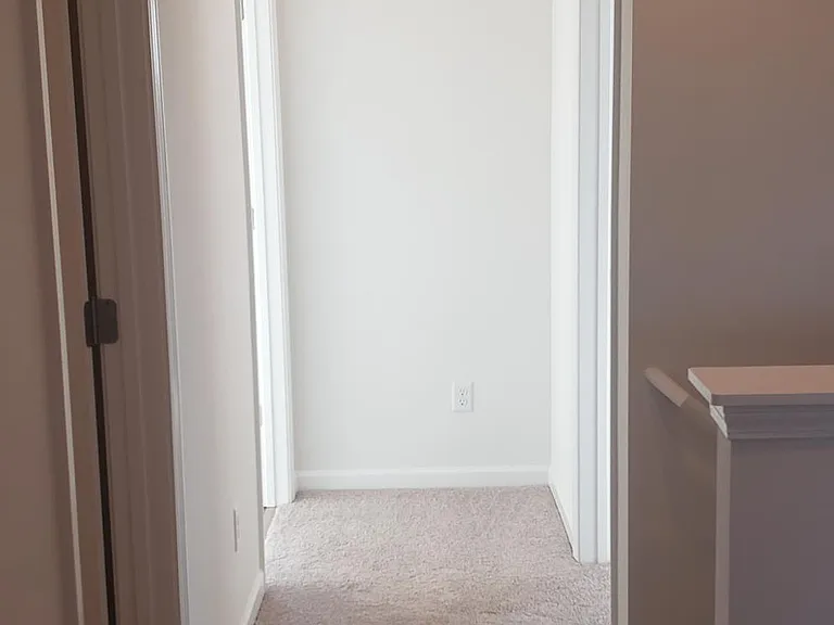 Upstairs hallway looking toward bedroom 3 and the laundry room