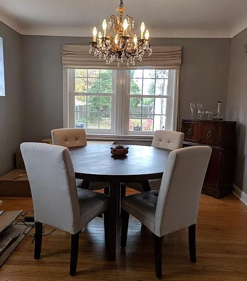 The dining room connects the kitchen and living room