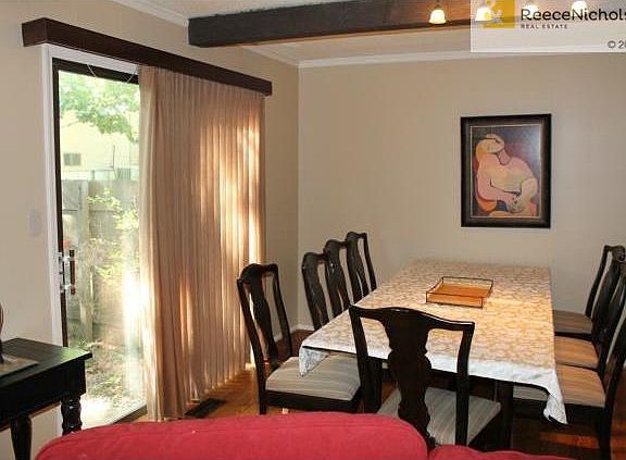 Light and Bright Formal Dining Room with Wood Floors.  Patio doo