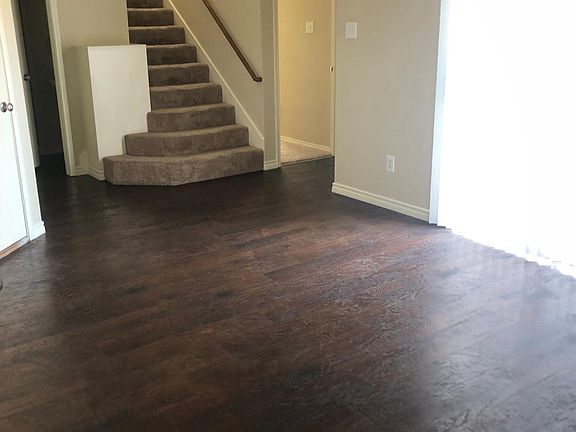 Dining, door to right of stairs is master bedroom, door to left of stairs is 1/2 bath