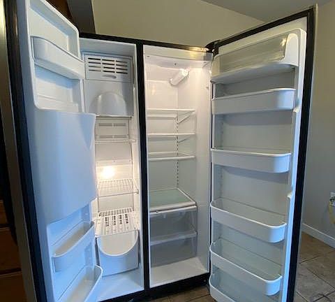 Large very clean fridge with ice maker