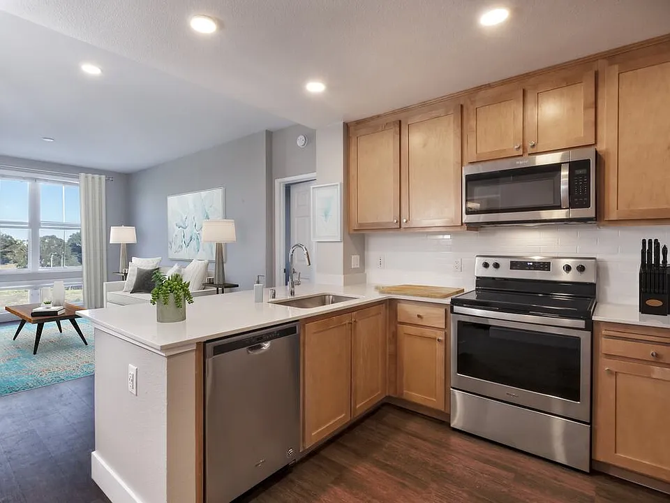 Renovated Package II Kitchen, living, and dining areas with hard surface flooring