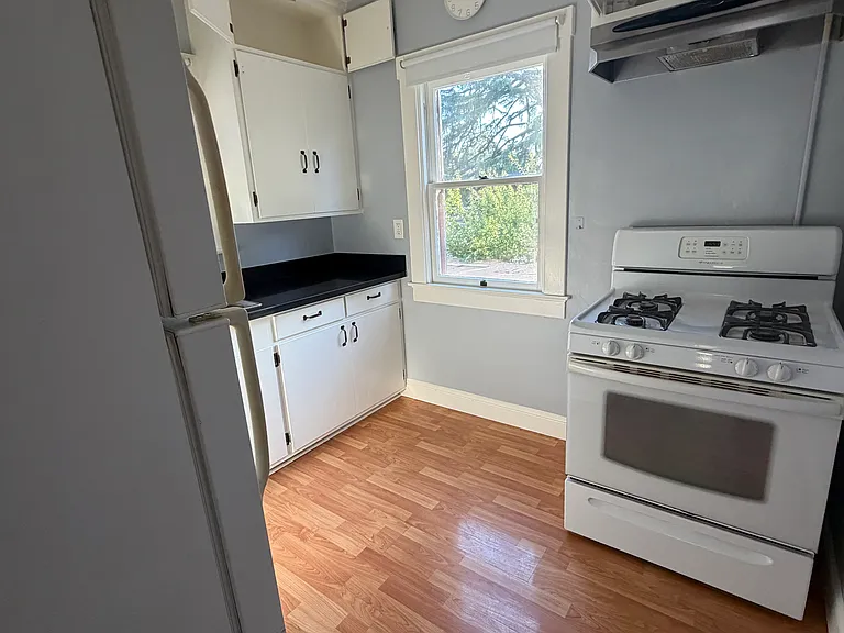 The kitchen features a gas stove.