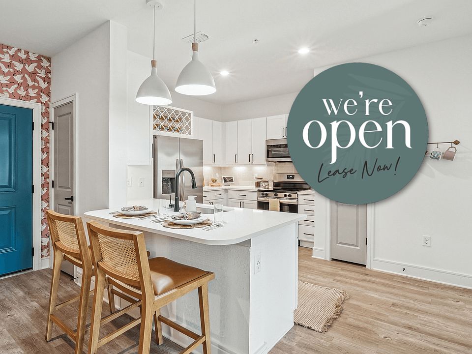 Kitchen with Quartz Countertop and Stainless Steel Appliances.