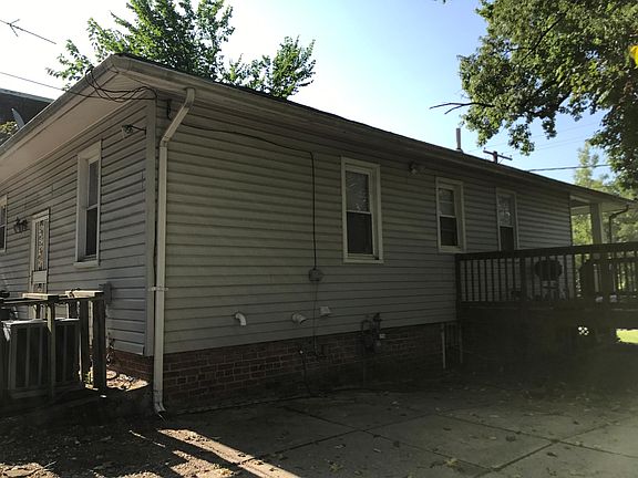 Side of house and parking area.