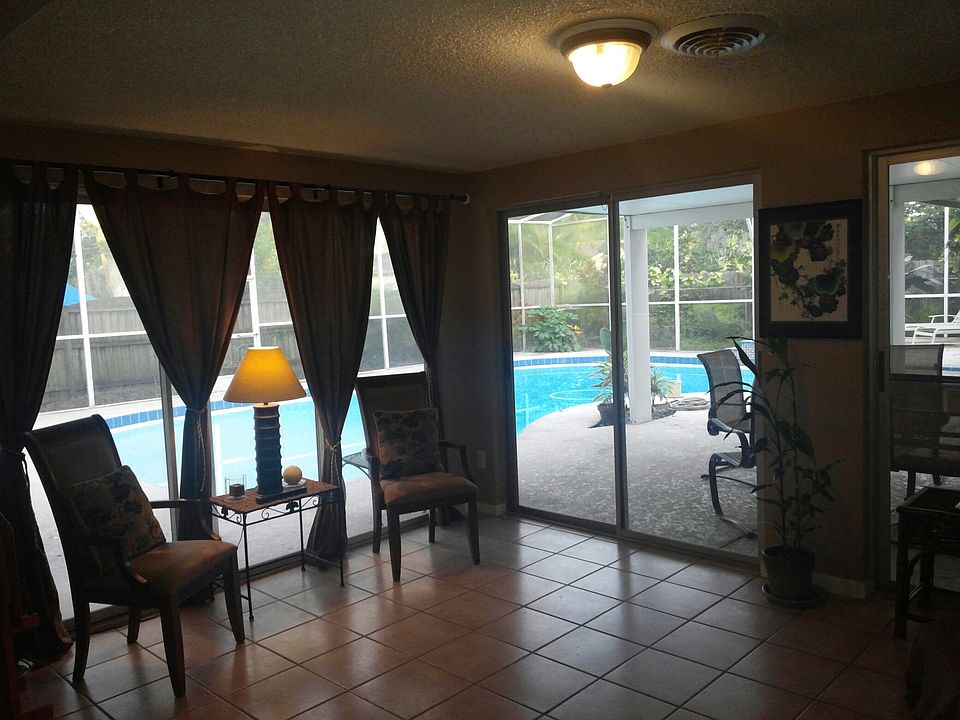 Sun room leading to pool