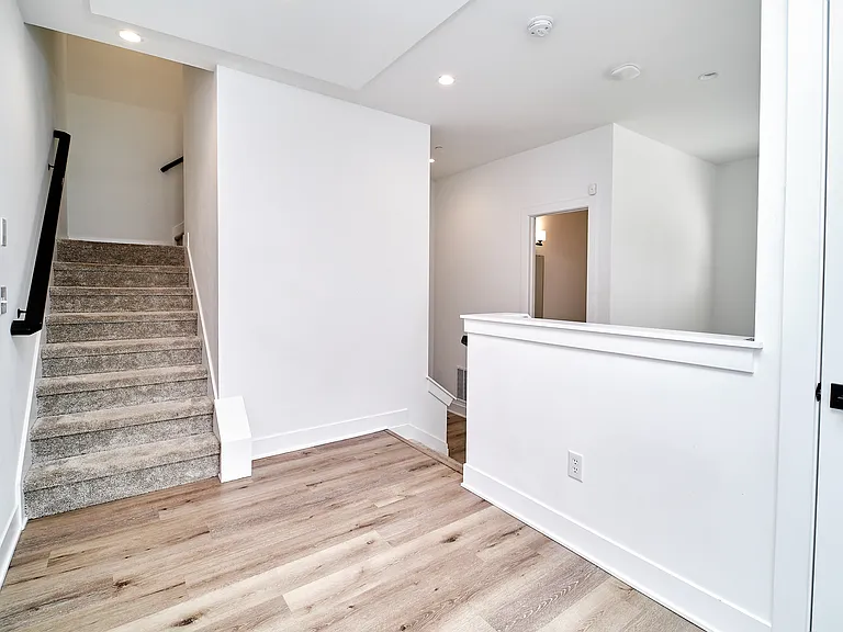 Landing to go to second level or down to the garage level