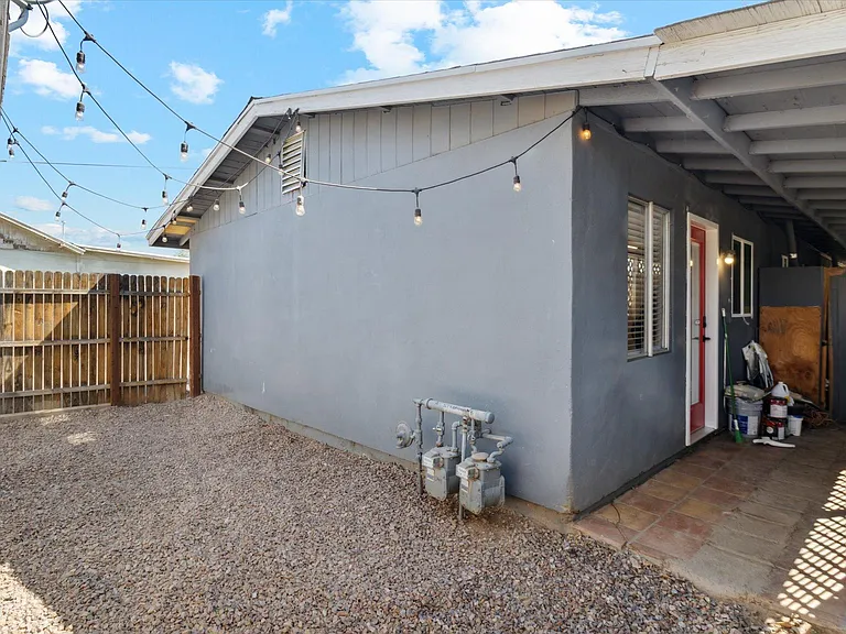Private backyard, perfect for pets. Decorative lights already hung for you!