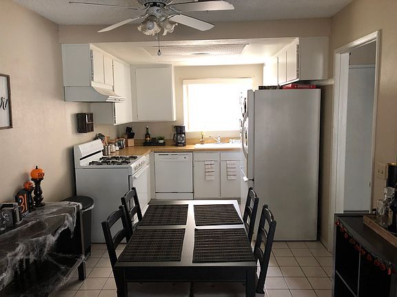 Similar Kitchen and Dining Area with fan/light. Kitchen lights are off (daytime picture)