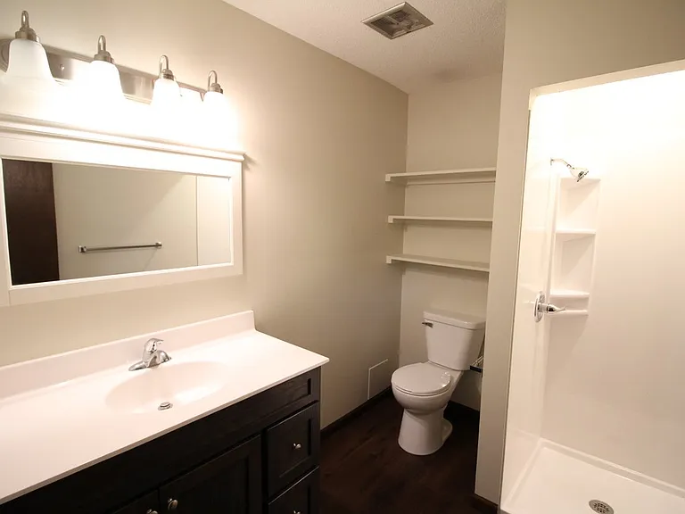 Primary Bathroom suite with private commode area.