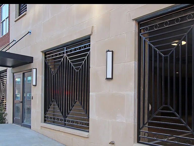 Elegant entrance to private parking and convenience of secure building access with wheelchair accessibility.