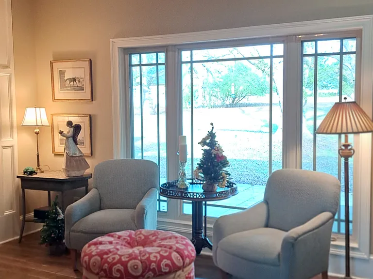 Great room with wonderful view of pecan grove out triple window