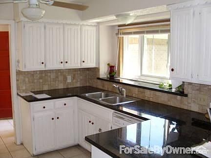 Living Room
						:
						Valuted ceiling; oversized ceiling fan; wood floor