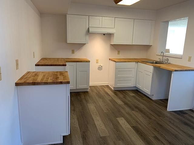 Kitchen with Cutout Overlooking Family Room