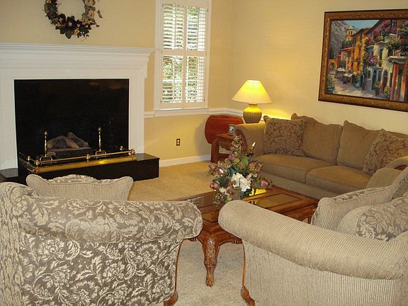 Living room w/ fireplace & wet bar