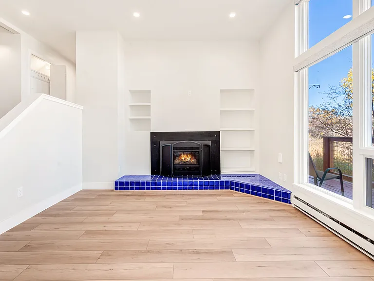 Living room with gas fireplace and walk out to back deck.