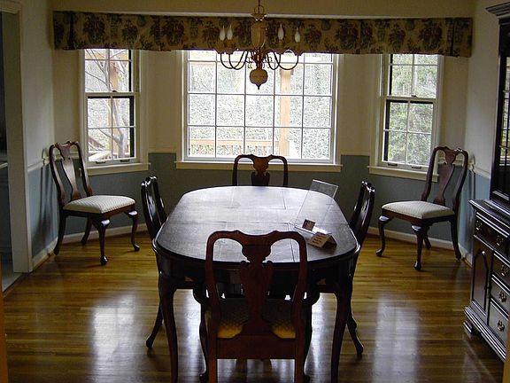 Hardwood Floors - Large Dining Room with chair rail and Bay window with view o