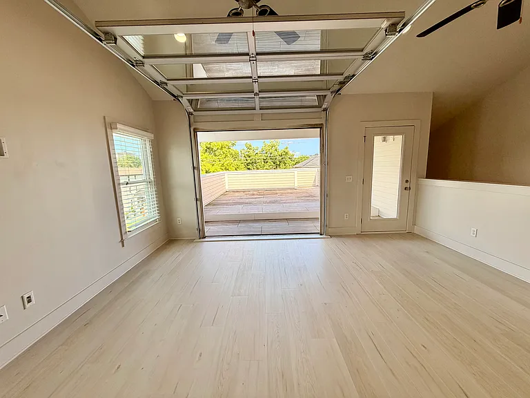 When the weather is good, open the garage door to your private deck area