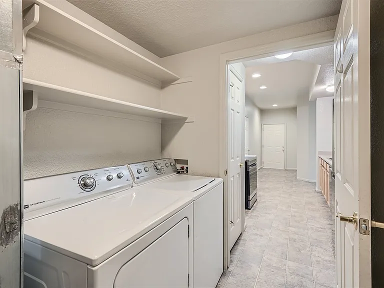 Laundry Room & View of Entryway