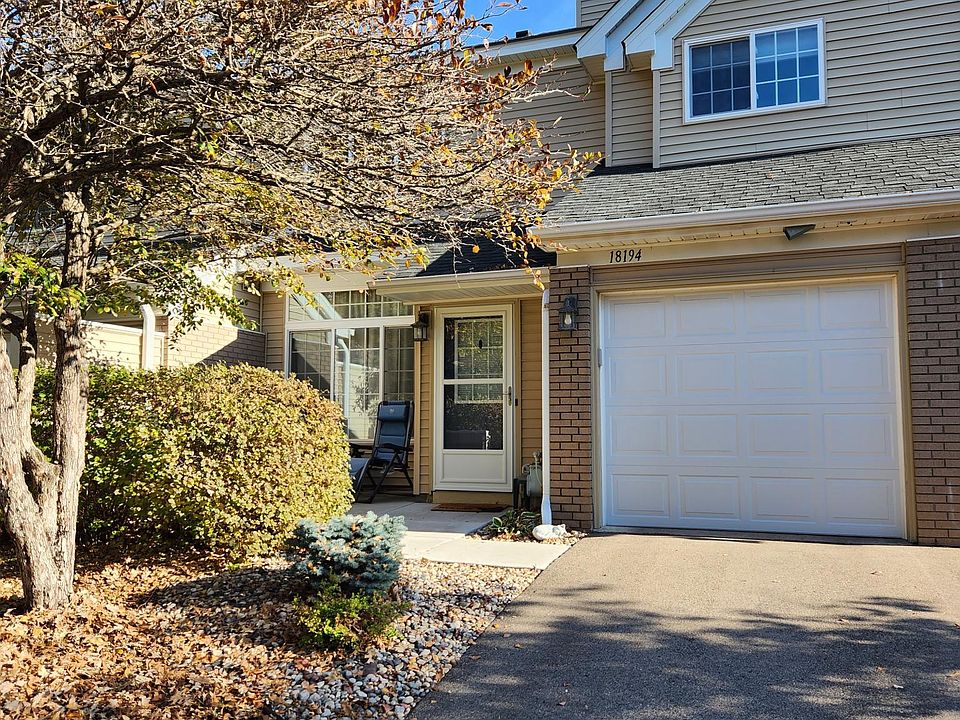 Front view of the house. 1 car garage and a small patio for grilling, dining or just to relax.