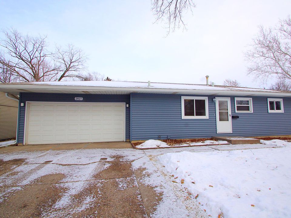 2 car attached garage, wide driveway and new windows, roof and siding create good curb appeal.