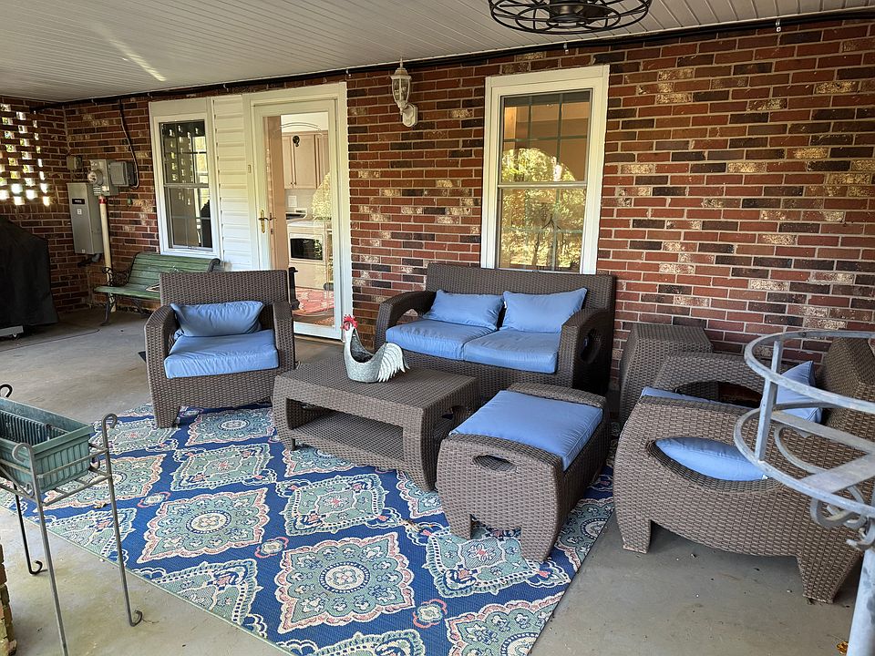 Charming patio is yours to enjoy - the perfect spot to enjoy morning coffee and watch the chickens roam. 

Smoking is permitted outside, but not inside. The grill is shared and you are free to use.