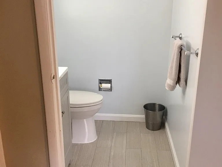 Updated half bath off family area downstairs.