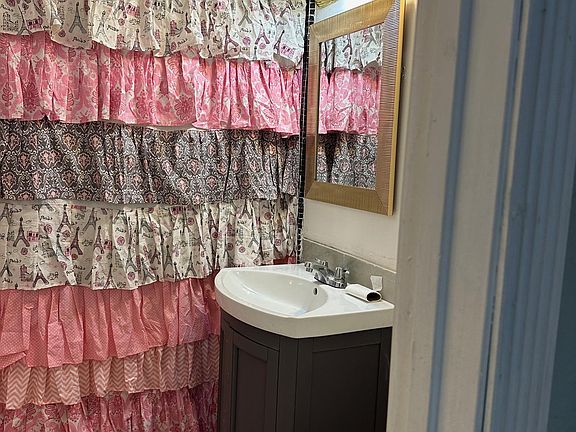 Bathroom with new ceramic tile and toilet.