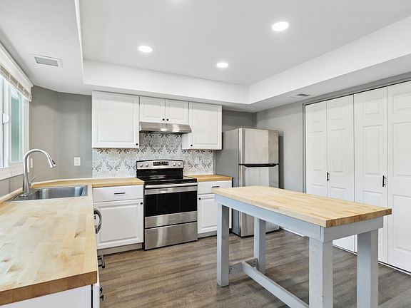Kitchen with Dish Washer, Stove, and Refrigerator - View 3