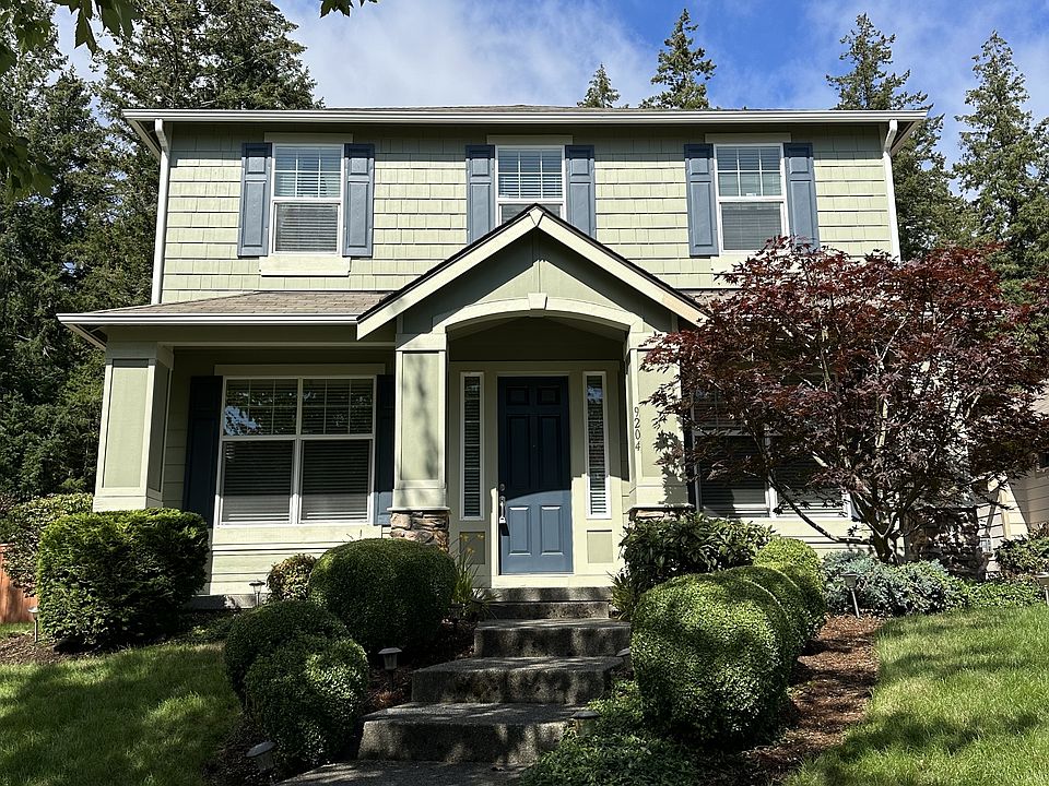 Front of the home, with a cute front porch and access to the sidewalk & a nearby grassy area!