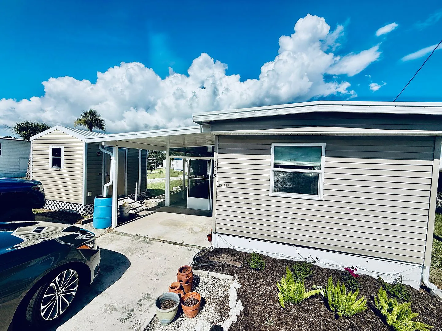 2/1 Charming 55+ Mobile Home Partially Furnished for Rent 1419 Turkey Creek Dr, Palm Bay, FL 32905 — Photo 1