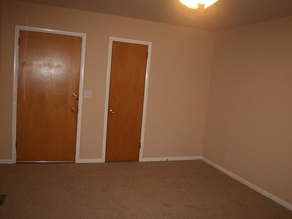 very large living room with deep coat closet.