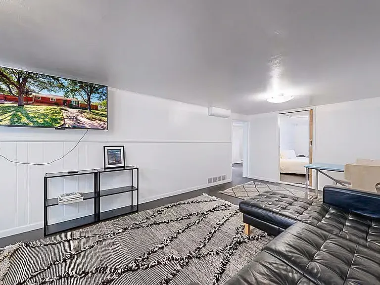 Downstairs living room with mounted TV