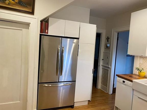 Remodeled Kitchen with Tile Backsplash, Wood Countertops and New Appliances