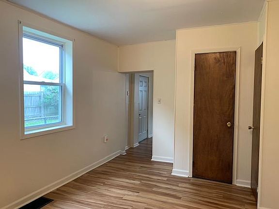 DR - first floor doorway into kitchen window faces neighboring property
