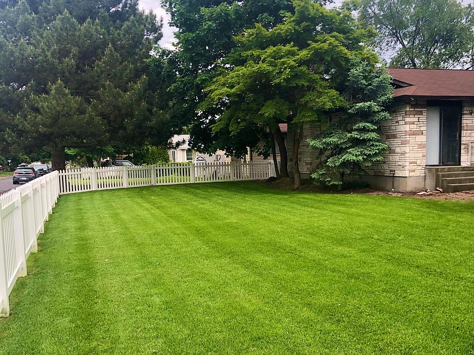 Partially fenced yard on sprinkler system
