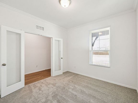 Oversized study with elegant French doors Real home pictured