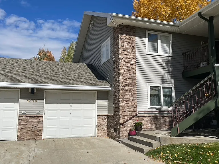 Garage is the one closest to the building.