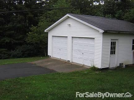 Garage
						:
						2 Car garage with work benches and storage area