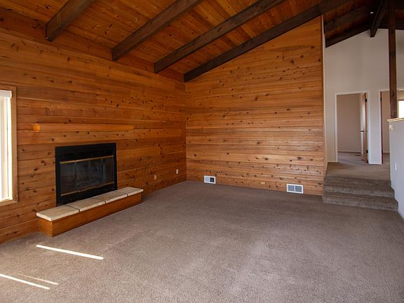 Open Beam Ceiling and wood burning fireplace