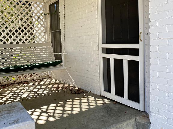 Front porch, porch swing and screen door