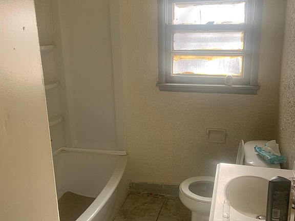 Bathroom nice condition; it even has a new tub.