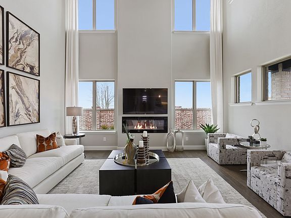 Living room in the Glacier home plan by Trophy Signature Homes - REPRESENTATIVE PHOTO