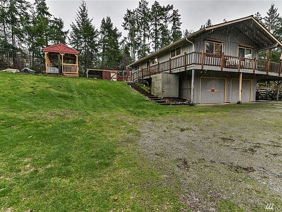2 car garage, wrap around deck, gazebo and a coupe of the outbuildings. Lots of outdoor storage!