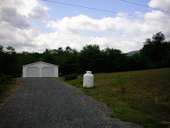 2 car garage with additional 2 acres of land!!