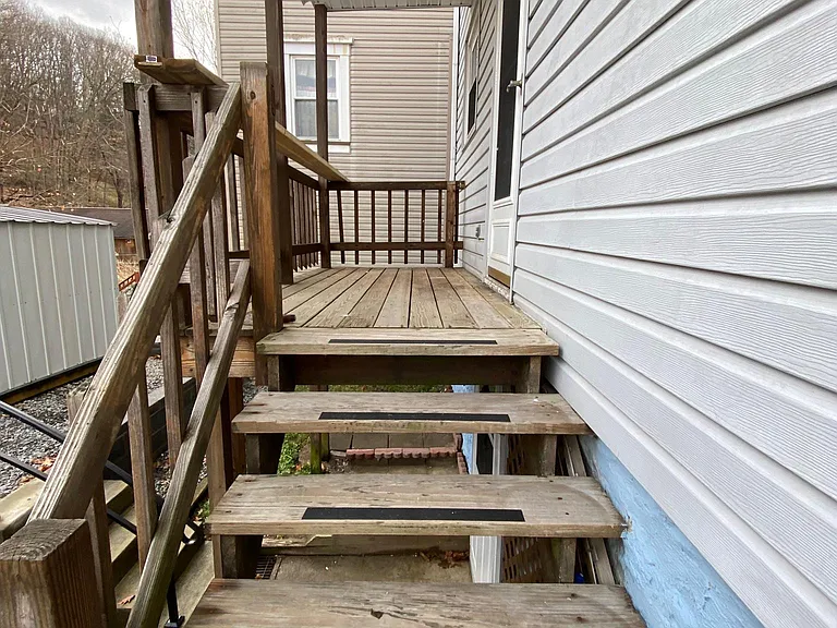 Back Porch- has lighted walkway.