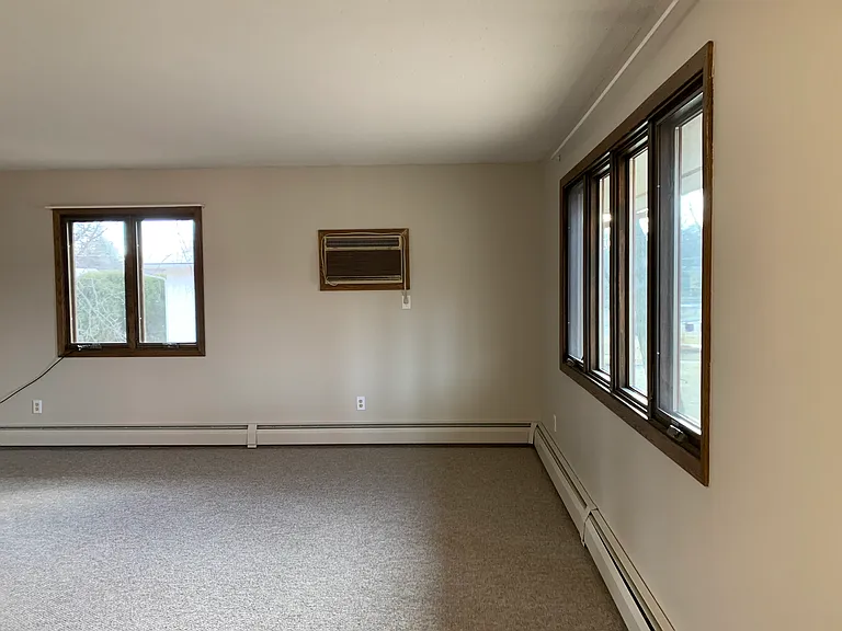 Living room with air conditioning looking from kitchen